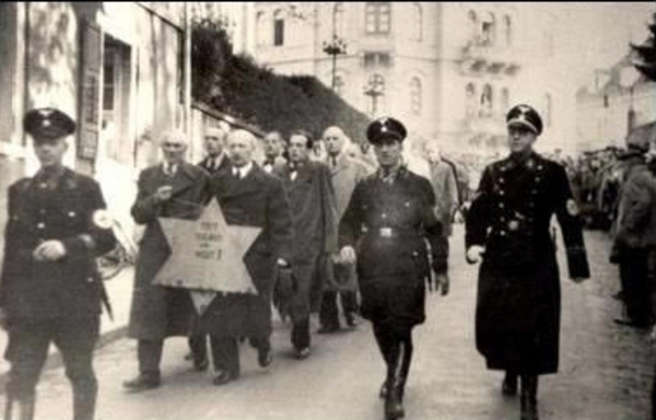 Jews forced to march with star Kristallnacht 01